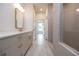 Spacious bathroom featuring a large vanity, tiled floor, and an open view to the shower at 606 Goldsmith Ct # 114, Johns Creek, GA 30022