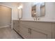 Bathroom featuring a double vanity with framed mirrors and tile flooring at 606 Goldsmith Ct # 114, Johns Creek, GA 30022