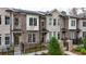 Well-maintained brick townhomes with charming black iron fences at 606 Goldsmith Ct # 114, Johns Creek, GA 30022