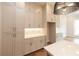 Spacious kitchen showcases white cabinets, quartz countertops, and modern pendant lighting at 606 Goldsmith Ct # 114, Johns Creek, GA 30022