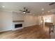 Living room featuring a tile fireplace, hardwood floors, and recessed lighting at 606 Goldsmith Ct # 114, Johns Creek, GA 30022