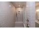 A stunning walk-in shower with tiled walls, a bench, and chrome fixtures at 606 Goldsmith Ct # 114, Johns Creek, GA 30022