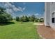 Well-maintained backyard with lush green grass and view of trees at 7550 Springmill Ct, Cumming, GA 30028