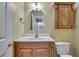 Bathroom featuring vanity, wood cabinet, and neutral wall color at 7550 Springmill Ct, Cumming, GA 30028