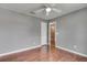 Bedroom features hardwood floors and neutral walls at 7550 Springmill Ct, Cumming, GA 30028