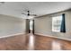 Spacious main bedroom with hardwood floors and large windows at 7550 Springmill Ct, Cumming, GA 30028