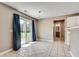 Dining area with sliding glass doors, tile flooring, and natural light at 7550 Springmill Ct, Cumming, GA 30028
