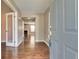 Inviting entryway with hardwood floors, neutral walls, and views of the living spaces at 7550 Springmill Ct, Cumming, GA 30028