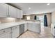 Well-lit kitchen featuring white cabinets and modern appliances at 7550 Springmill Ct, Cumming, GA 30028