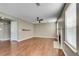 Spacious living room with hardwood floors, fireplace, and ample natural light at 7550 Springmill Ct, Cumming, GA 30028