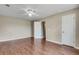 Spacious main bedroom with ceiling fan, hardwood floors, and a private ensuite at 7550 Springmill Ct, Cumming, GA 30028