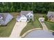 An aerial view of a white two-story home with a well-kept lawn in a suburban neighborhood at 197 Stafford Ln, Villa Rica, GA 30180