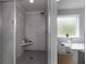 Elegant bathroom featuring walk-in shower with bench and soaking tub with a window view at 197 Stafford Ln, Villa Rica, GA 30180