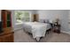 Cozy bedroom featuring a large window, neutral colors and carpet at 197 Stafford Ln, Villa Rica, GA 30180