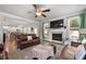 Cozy living room featuring a fireplace, plush seating, and an open layout at 197 Stafford Ln, Villa Rica, GA 30180