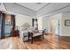 Spacious primary bedroom suite with trey ceiling, hardwood floors, and a cozy seating area at 1025 Ector Nw Dr, Kennesaw, GA 30152