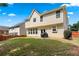 Exterior view of a home with a grassy backyard and patio area at 1146 Simonton Peak Way, Lawrenceville, GA 30045