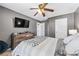 Comfortable bedroom featuring a ceiling fan, TV, and neutral decor at 1146 Simonton Peak Way, Lawrenceville, GA 30045