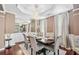 Elegant dining area featuring a coffered ceiling, stylish chandelier, and refined decor, ideal for formal gatherings at 1146 Simonton Peak Way, Lawrenceville, GA 30045