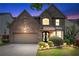 Charming two-story brick home with manicured landscaping and inviting entrance at 1146 Simonton Peak Way, Lawrenceville, GA 30045