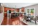 Spacious kitchen with wood cabinets, stainless steel appliances, and an island with seating, perfect for modern living at 1146 Simonton Peak Way, Lawrenceville, GA 30045