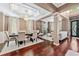 Open-concept living and dining area with hardwood floors, elegant décor, and natural light, perfect for entertaining at 1146 Simonton Peak Way, Lawrenceville, GA 30045
