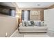 This living room features a comfortable couch, decorative pillows, and a TV at 1146 Simonton Peak Way, Lawrenceville, GA 30045
