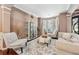 Cozy living room featuring stylish seating, decorative accents, and natural light, creating an inviting and comfortable space at 1146 Simonton Peak Way, Lawrenceville, GA 30045
