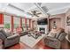Comfortable living area with a fireplace, plush seating, and a ceiling fan, creating a cozy and inviting atmosphere at 1146 Simonton Peak Way, Lawrenceville, GA 30045