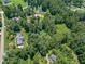 A home surrounded by lush trees offers a tranquil retreat from the hustle and bustle of city life at 1725 Mountainside Dr, Cumming, GA 30040