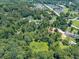Nestled in a densely wooded area, this beautiful property offers a unique combination of seclusion and convenience at 1725 Mountainside Dr, Cumming, GA 30040