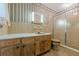 A full bathroom features a vanity, toilet, and enclosed shower stall at 1725 Mountainside Dr, Cumming, GA 30040