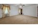 Neutral carpeted bedroom features a ceiling fan and classic light-toned curtains at 1725 Mountainside Dr, Cumming, GA 30040
