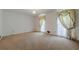 A bedroom with carpeted floor, neutral walls and decorative curtains on the windows at 1725 Mountainside Dr, Cumming, GA 30040