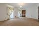 A bedroom with carpeted floor, neutral walls, decorative curtains and a closet at 1725 Mountainside Dr, Cumming, GA 30040