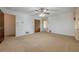 A spacious carpeted bedroom includes a ceiling fan, closet, and natural light at 1725 Mountainside Dr, Cumming, GA 30040