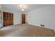 A bedroom with carpeted floor, neutral walls, decorative curtains and closet at 1725 Mountainside Dr, Cumming, GA 30040