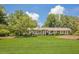 Lovely brick home featuring manicured landscaping, a well-kept lawn and classic architectural design at 1725 Mountainside Dr, Cumming, GA 30040