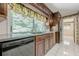 Traditional kitchen with wood cabinets, light countertops and appliances at 1725 Mountainside Dr, Cumming, GA 30040