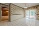 Eat-in kitchen features tile flooring, slider door and unique wall paper at 1725 Mountainside Dr, Cumming, GA 30040
