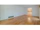 Bright living room features gleaming hardwood floors and neutral walls, perfect for relaxing at 1725 Mountainside Dr, Cumming, GA 30040