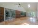 Light-filled sunroom features hardwood floors, brick accents, and large windows offering serene views at 1725 Mountainside Dr, Cumming, GA 30040