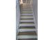 Staircase featuring wood and white risers and white railing at 1947 Kensington High Sw St, Lilburn, GA 30047