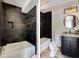 Bathroom showcasing a bathtub and a single vanity with a dark cabinet at 3960 Clairmont Rd # 2, Chamblee, GA 30341