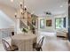 Bright living area with stylish chandelier, hardwood floors, and staircase at 3960 Clairmont Rd # 2, Chamblee, GA 30341