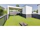 This rooftop deck features artificial turf and covered area for lounging or entertaining, great for city views at 3960 Clairmont Rd # 2, Chamblee, GA 30341