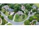 An aerial view of a suburban neighborhood showcasing mature trees, well-maintained lawns, and winding streets at 5995 Ettington Dr, Suwanee, GA 30024