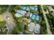 Aerial view of community amenities with multiple tennis courts and a swimming pool at 5995 Ettington Dr, Suwanee, GA 30024