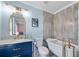 Stylish bathroom featuring a vintage clawfoot tub, modern vanity, and unique tile work at 5995 Ettington Dr, Suwanee, GA 30024