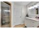 Neutral bathroom featuring a walk-in shower, vanity with drawers and a tile floor at 5995 Ettington Dr, Suwanee, GA 30024